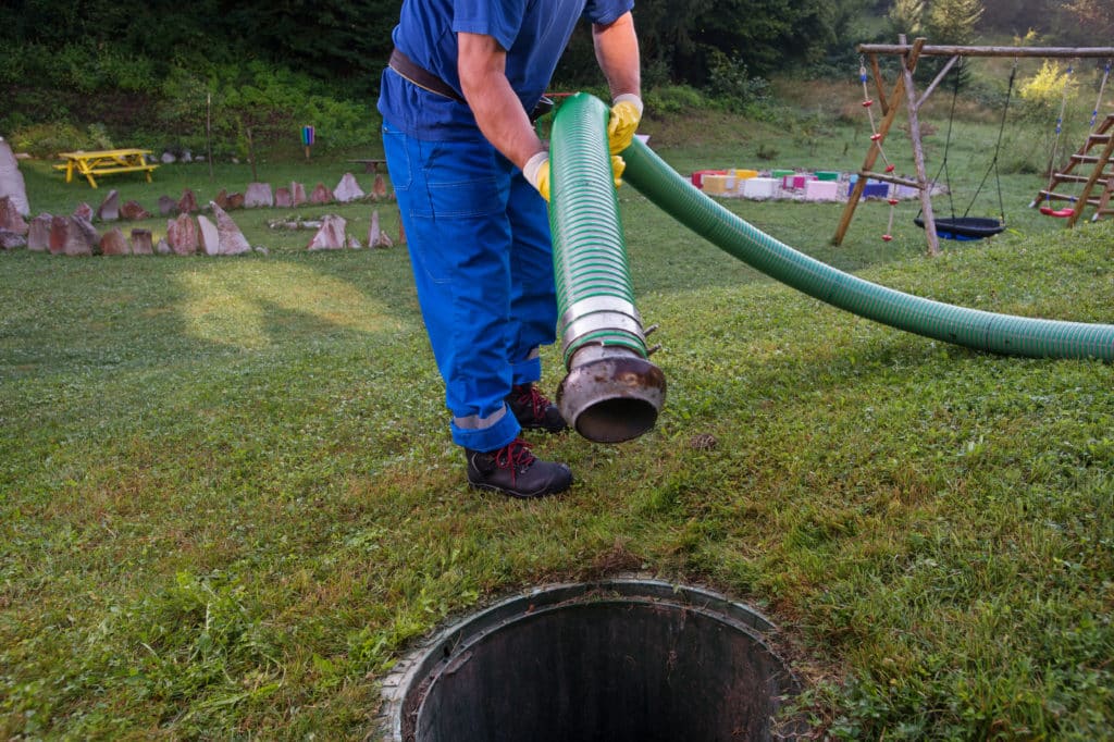 Emptying Household Septic Tank. Cleaning And Unblocking Clogged Drain With