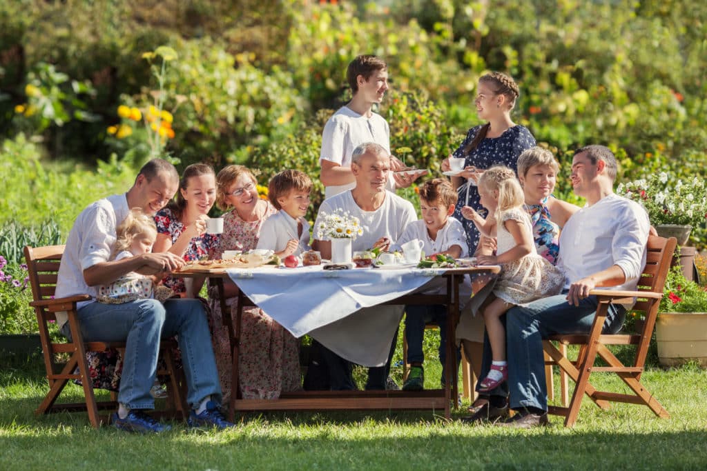 Most Beautiful Happy Family In Garden Portrait Of Three Generations 