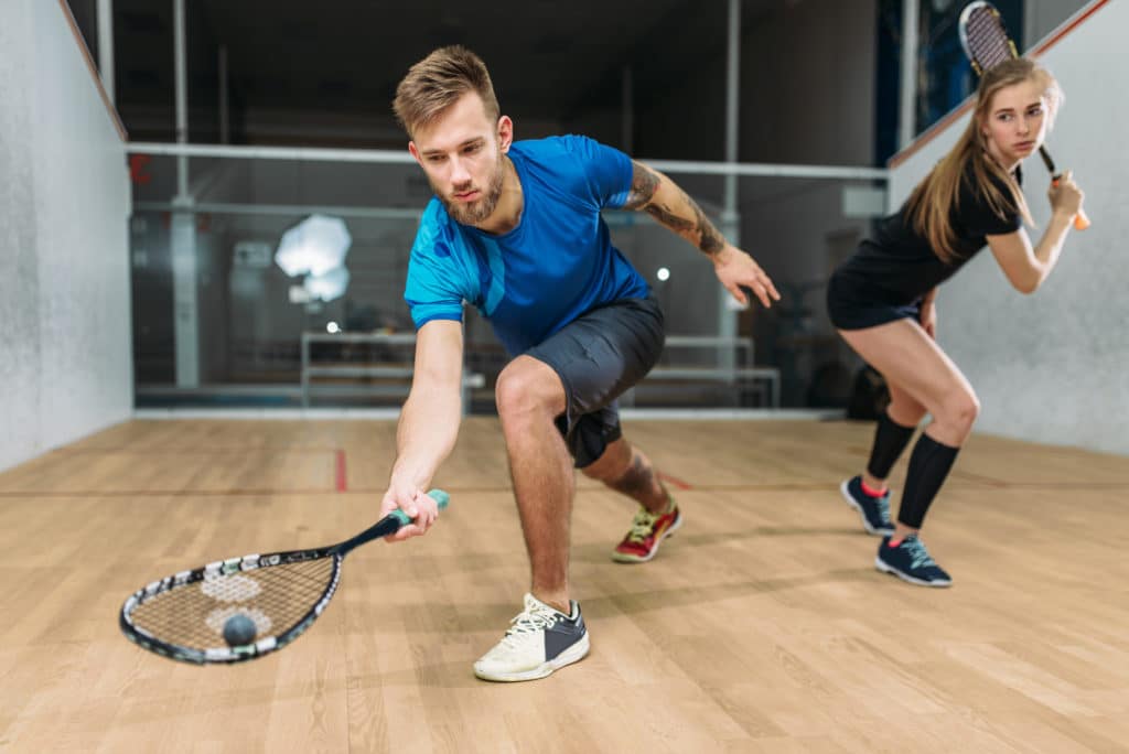Squash Game Training Players With Rackets