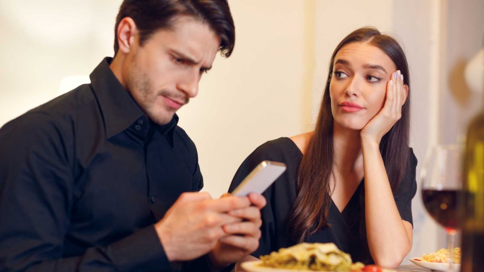 Man Using Mobile During Dating