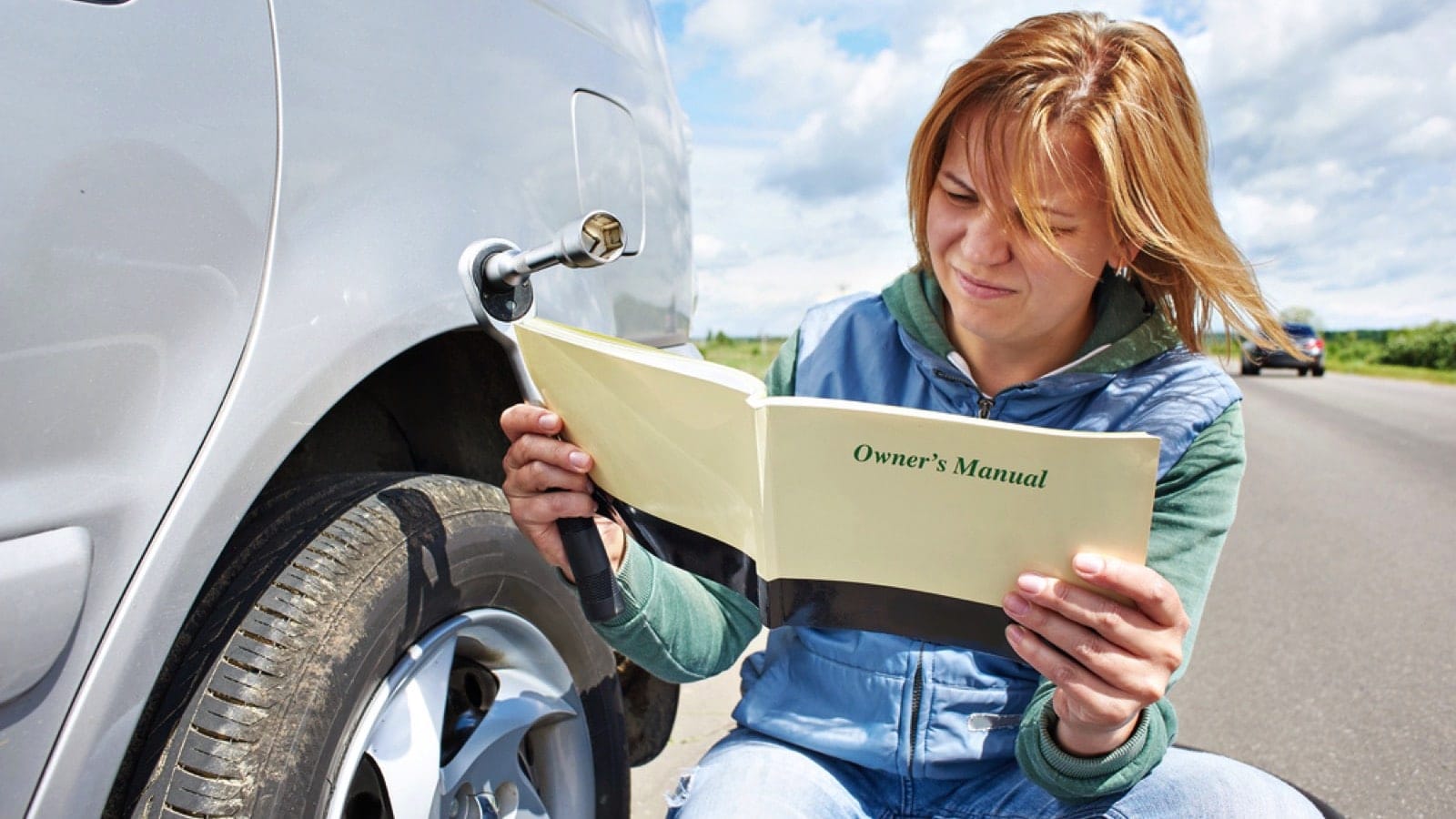 Woman Reading Owner's Manual