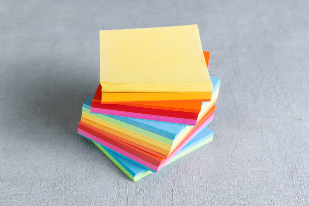 A Pile Of Colored Post Its