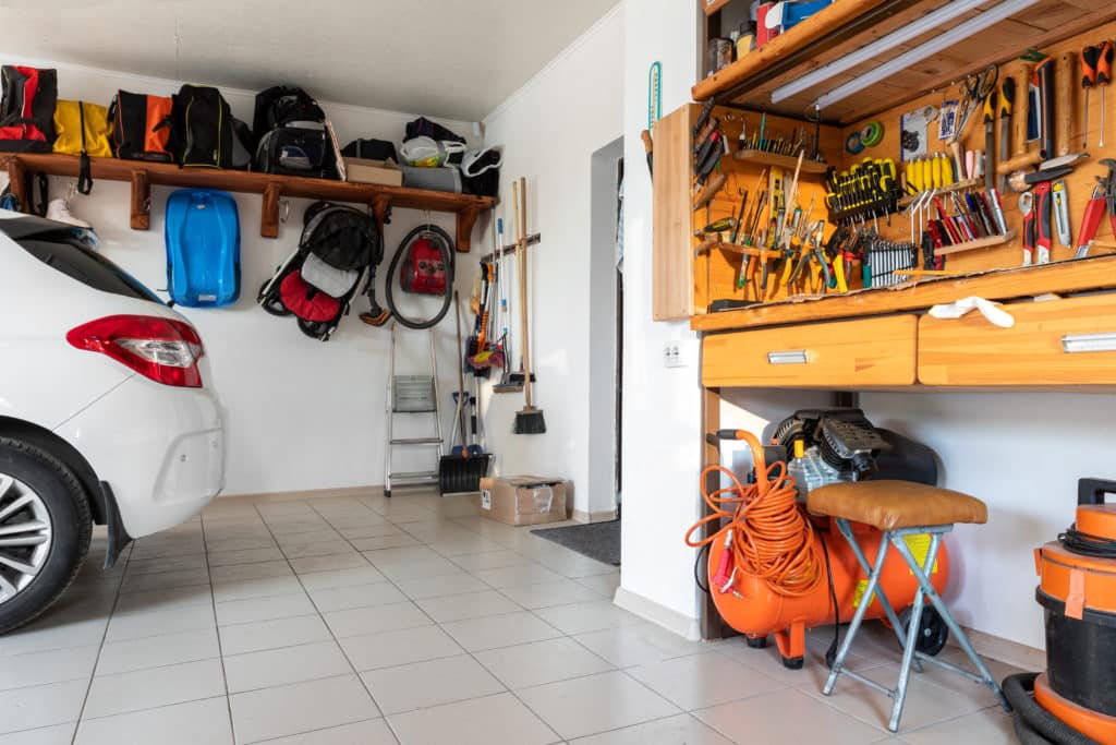Home Suburban Car Garage Interior With Wooden Shelf Tools Equipment