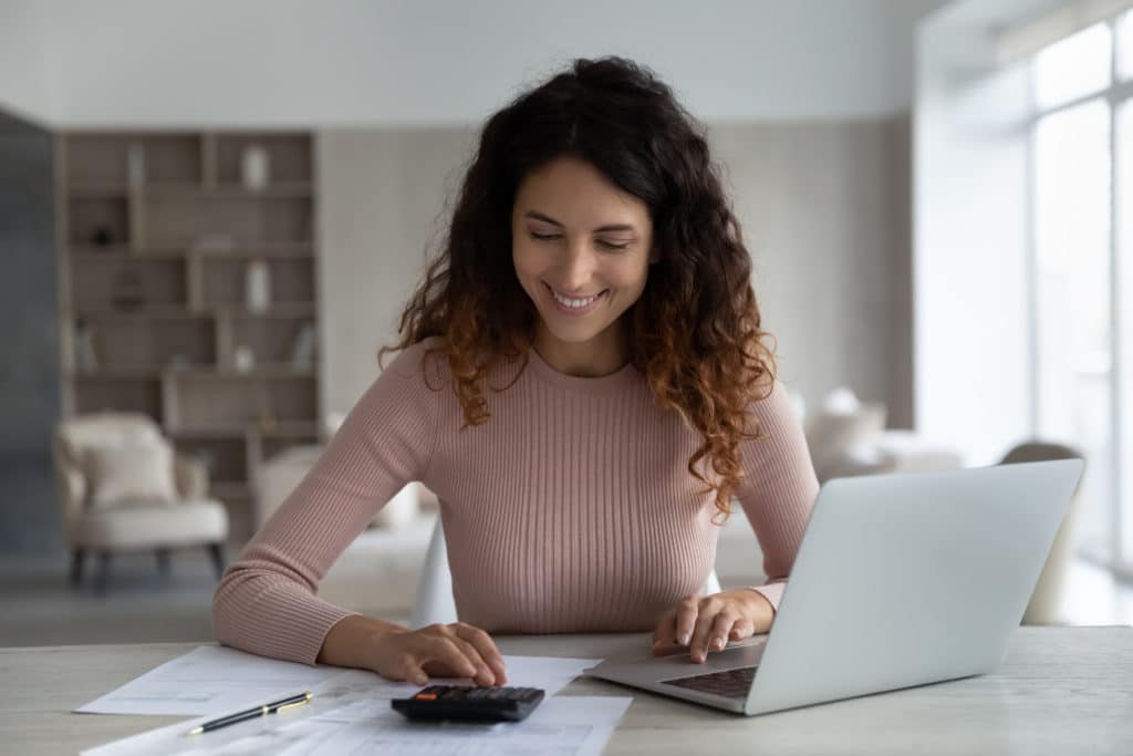 Smiling Young Hispanic Woman Manage Household Family Budget Pay Bills