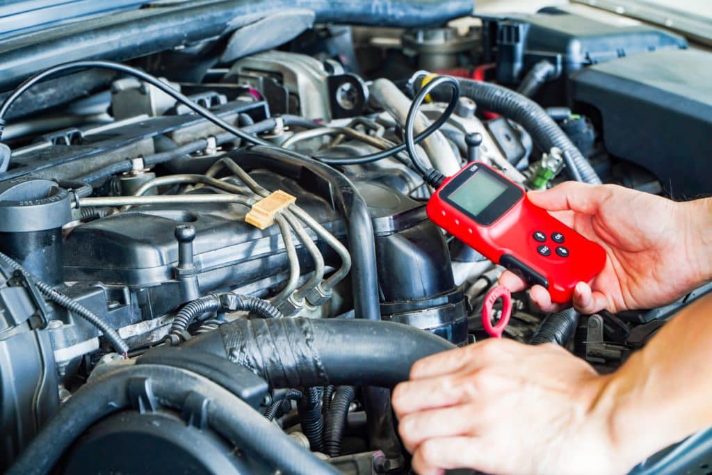 Mechanic Is Using A Diagnostic Car Code Reader.car Computer Error