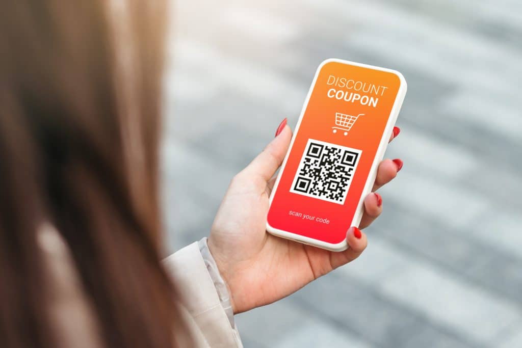 Discount Coupon With Qr Code On Smartphone In A Female