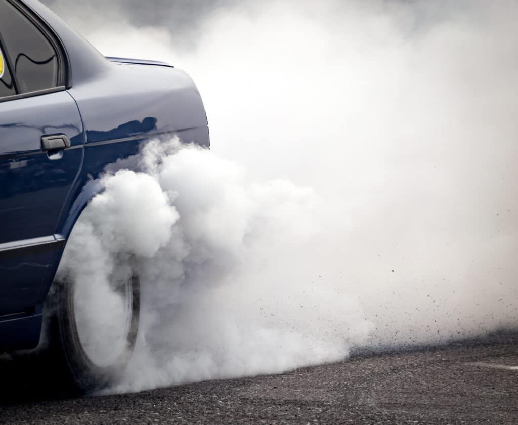 Smoke From Under The Wheels Of The Car