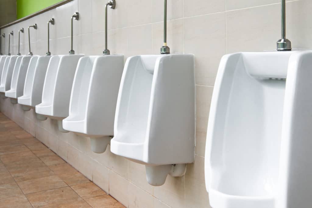 White Urinal In Men's Bathroom