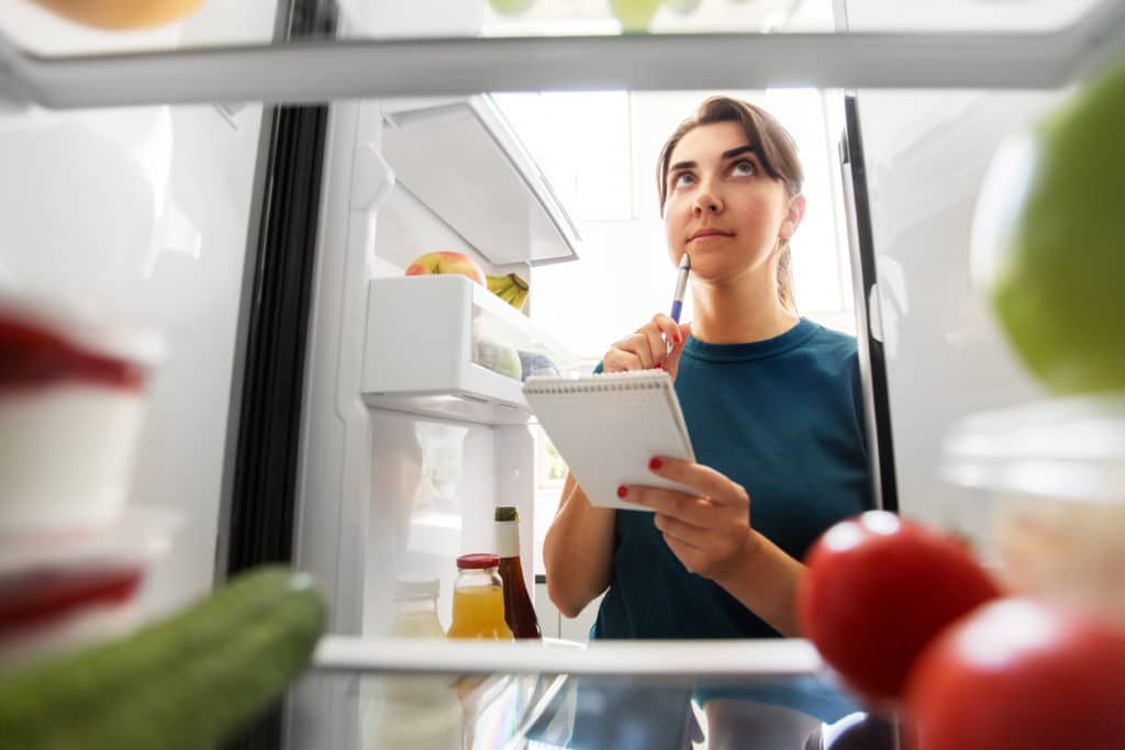 Healthy Eating And Diet Concept Woman Opening Fridge And