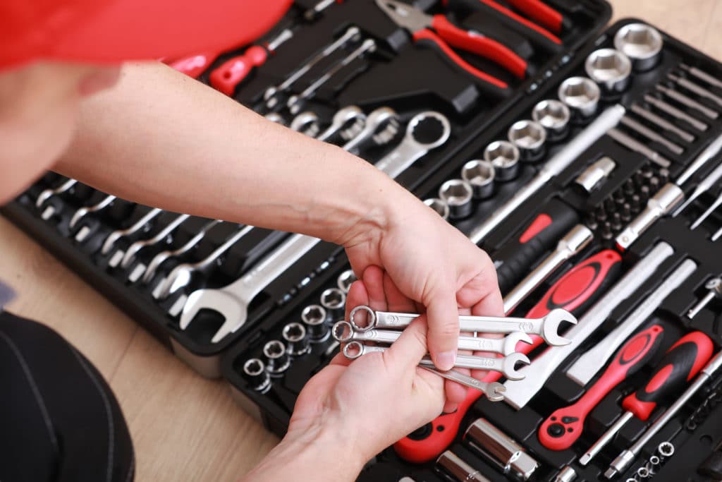 Tool Store. Closeup Of Male Hand Holding Wrenches. Auto Repair