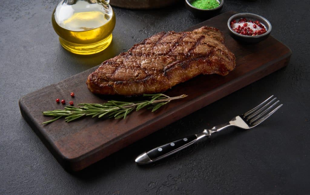 Fresh Juicy Delicious Beef Steak Served On Wooden Cutting Board