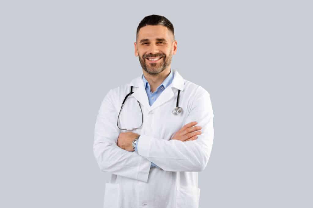 Healthcare Medical Staff Concept. Portrait Of Smiling Male Doctor Posing
