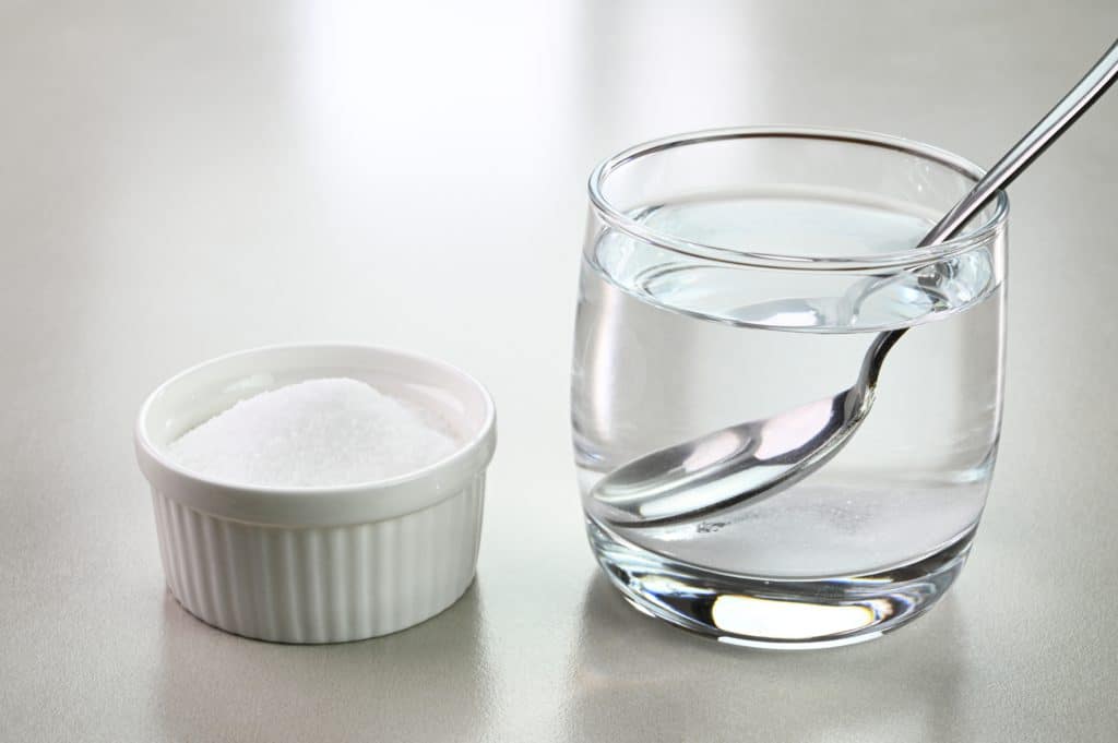 Salt Water In A Glass Cup And Salt In A