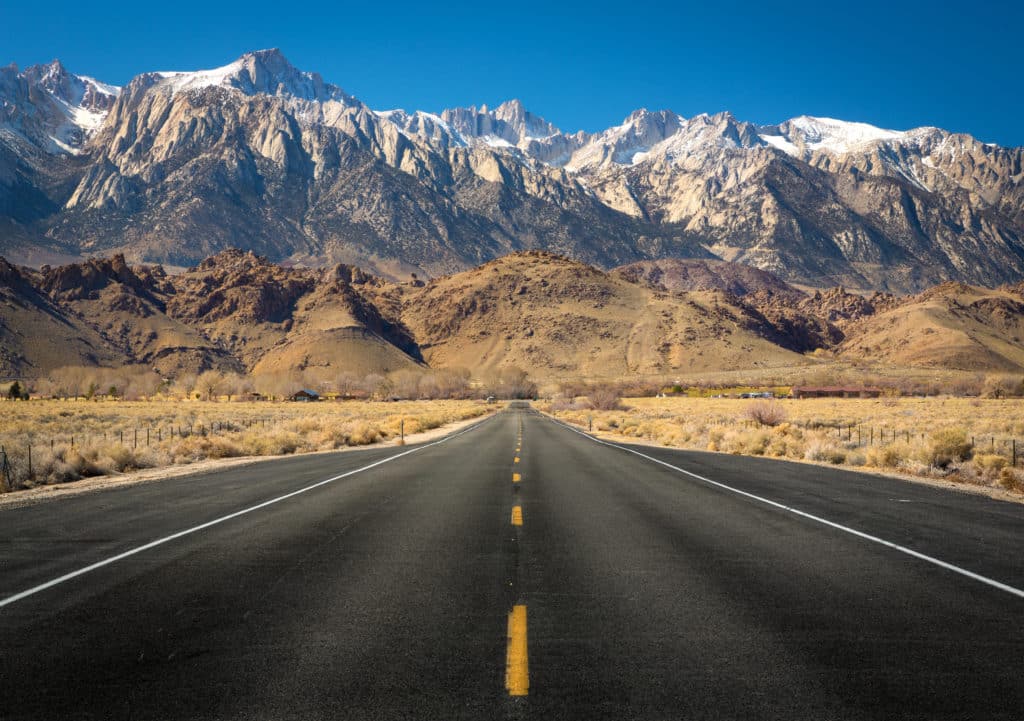 View Of Mt Whitney With A Straight Empty Road