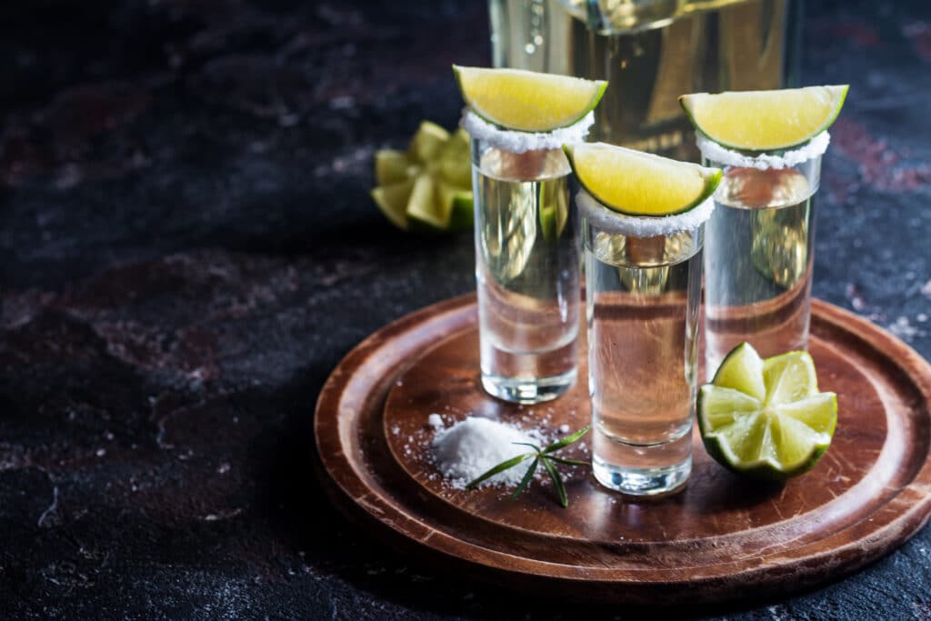 Mexican Gold Tequila With Lime And Salt On Black Background