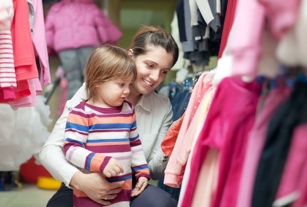 2 Years Child With Mother Chooses Wear At Shop