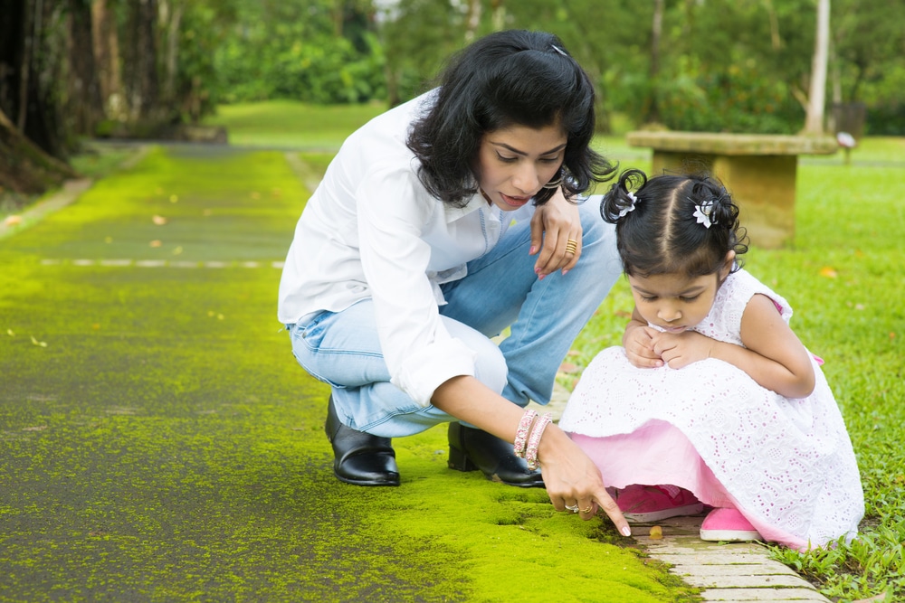 Indian Family Outdoor Activity. Candid Portrait Of Mother And Daughter